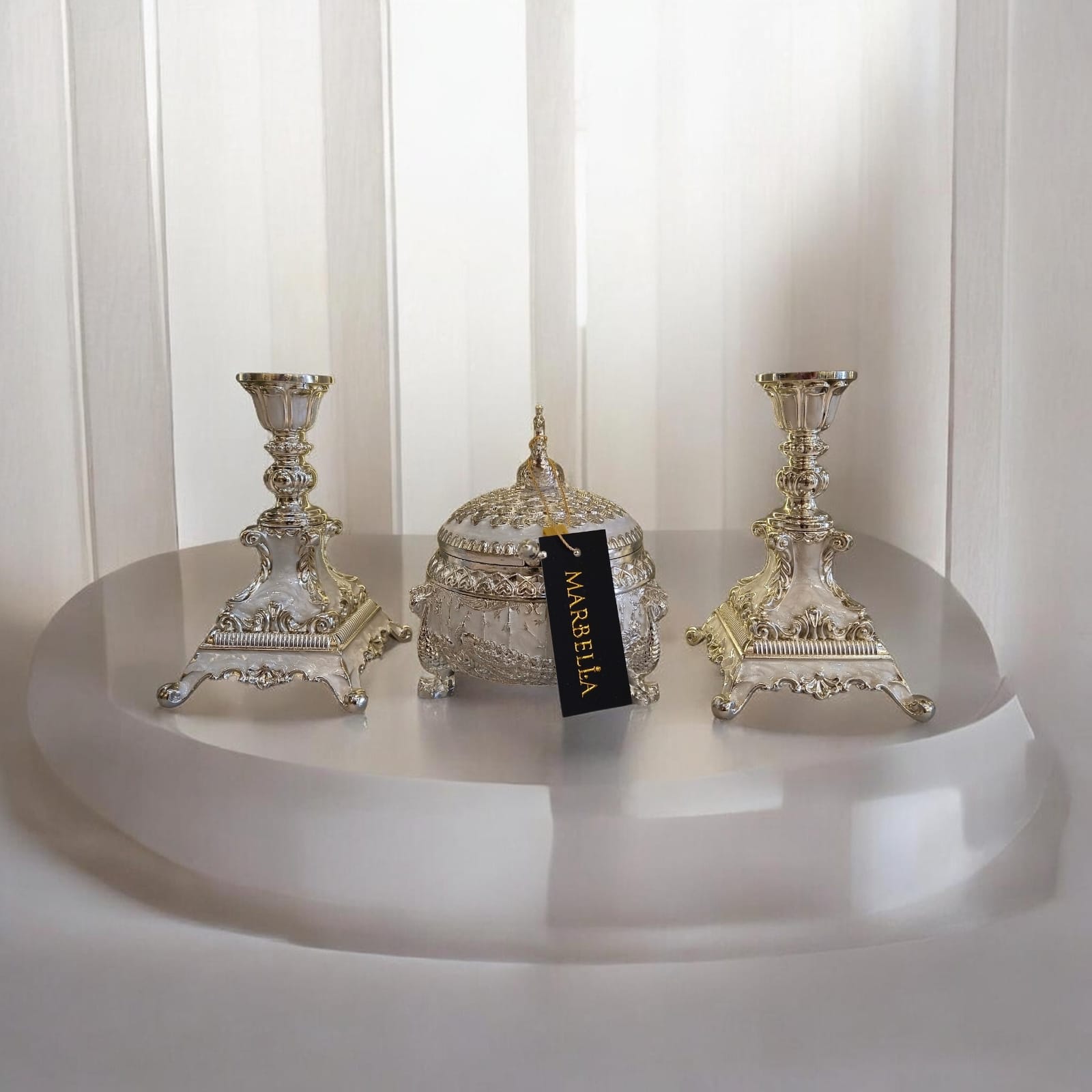 candle holders and a matching decorative trinket box.